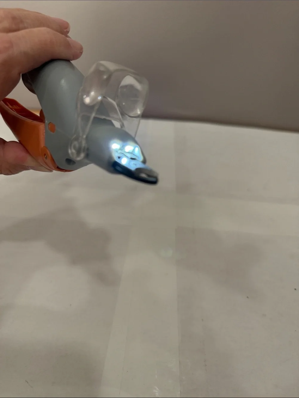 Gray and Orange Plastics Dog and Cat Nail Clippers that lights up.